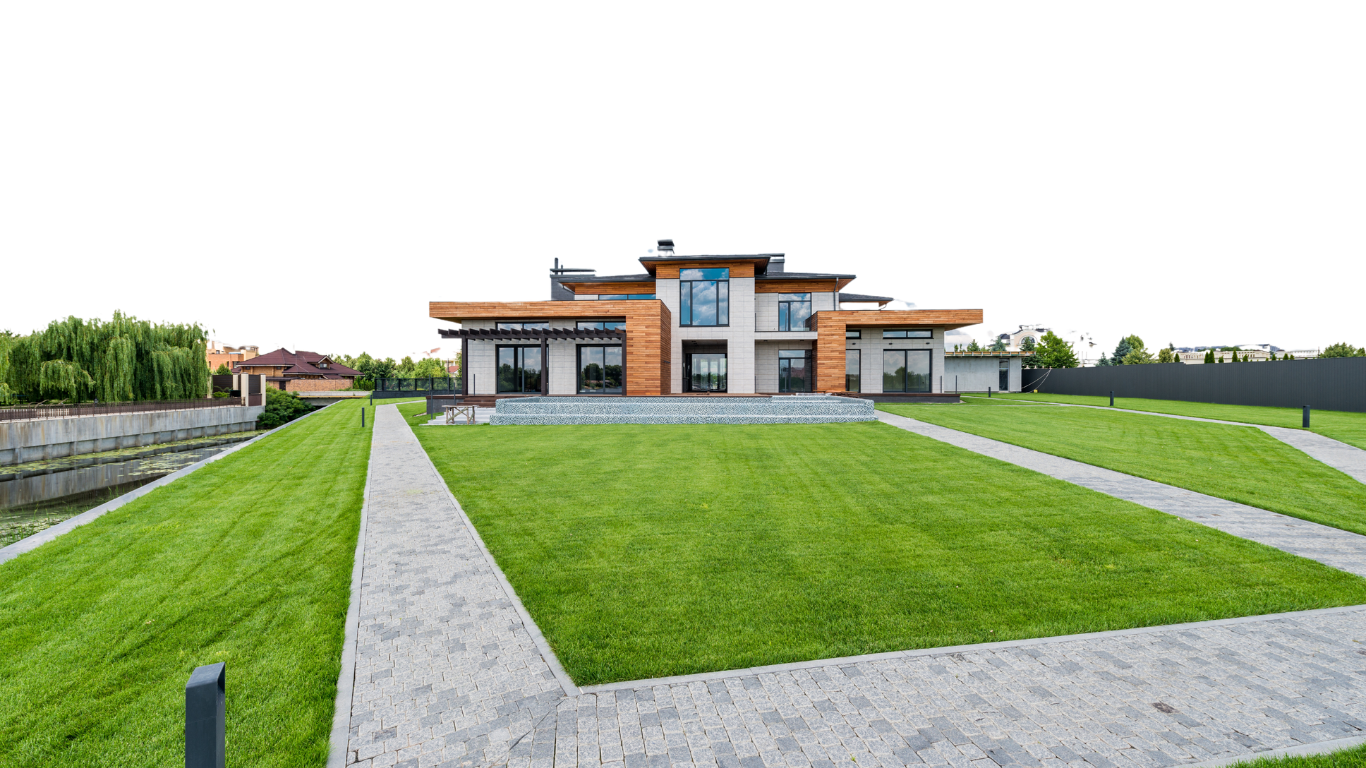 A clean, modern landscape with manicured lawn and pathways